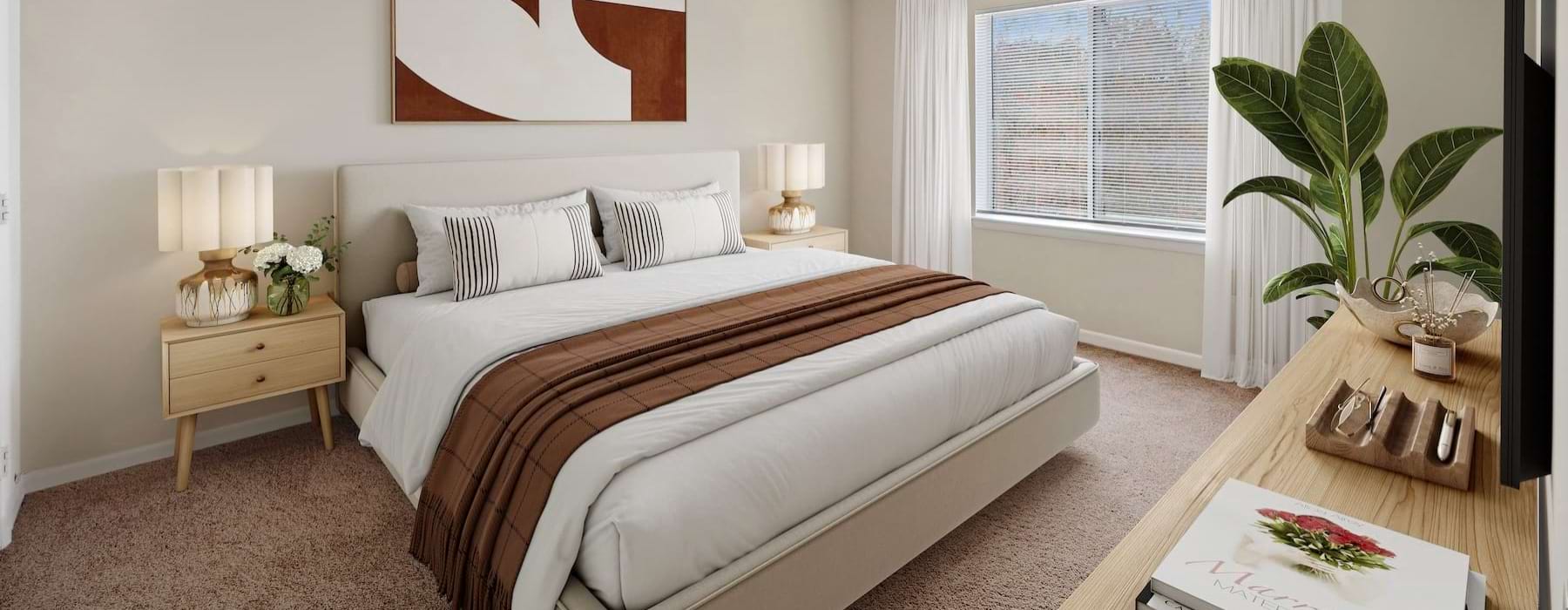 Spacious bedroom with large window and plant