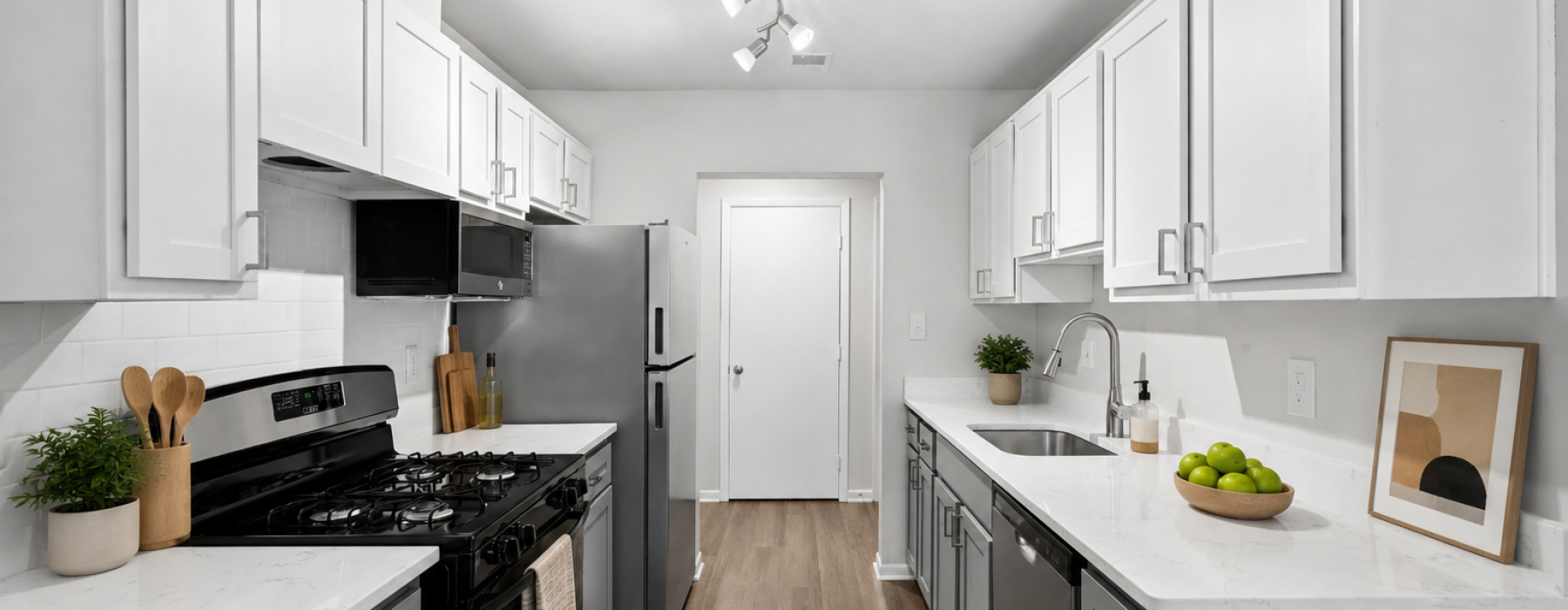 Kitchen with white countertops and cabinets