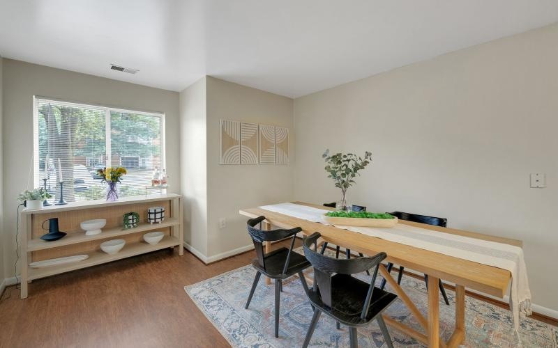 a dining room with a table and chairs