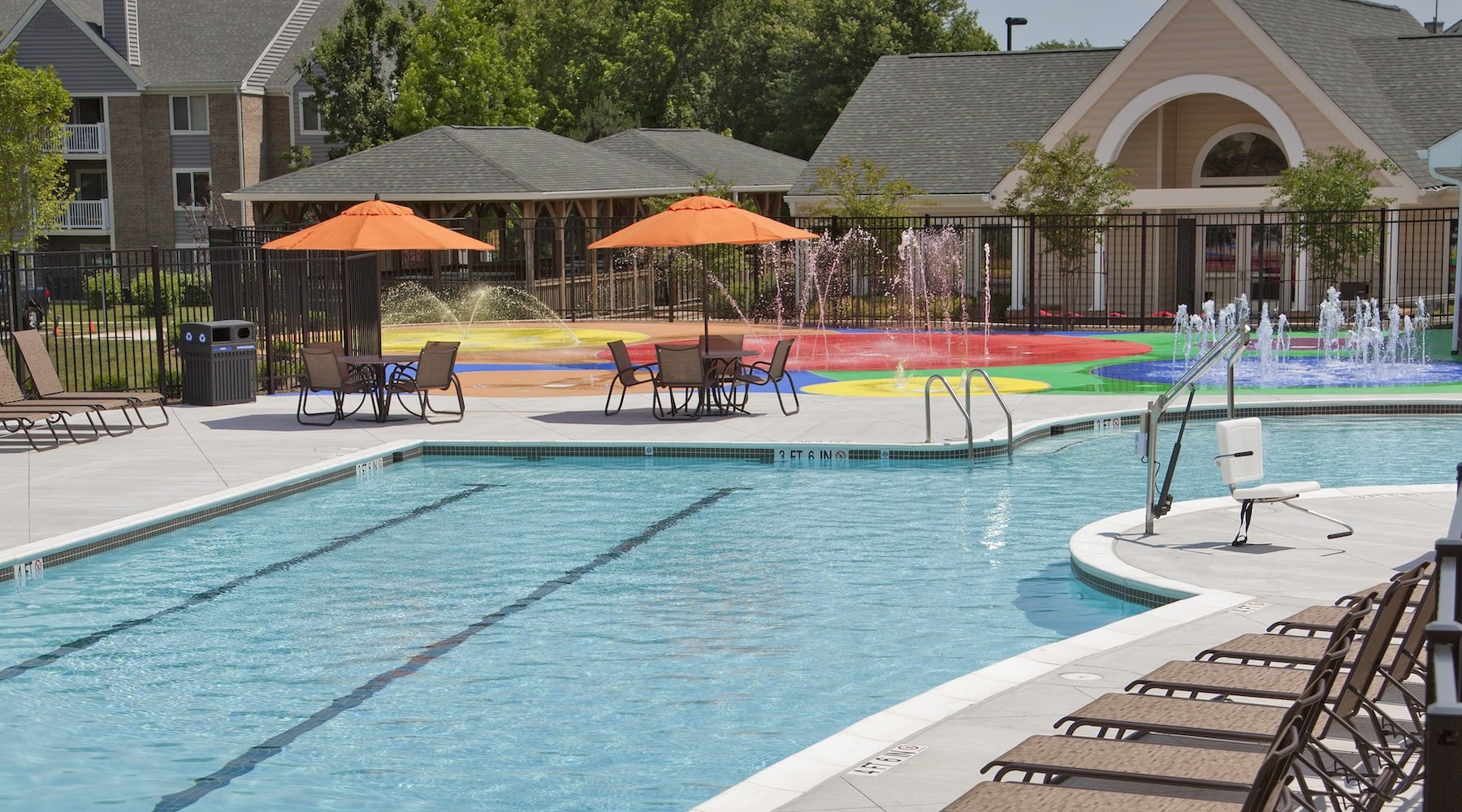 a swimming pool with chairs