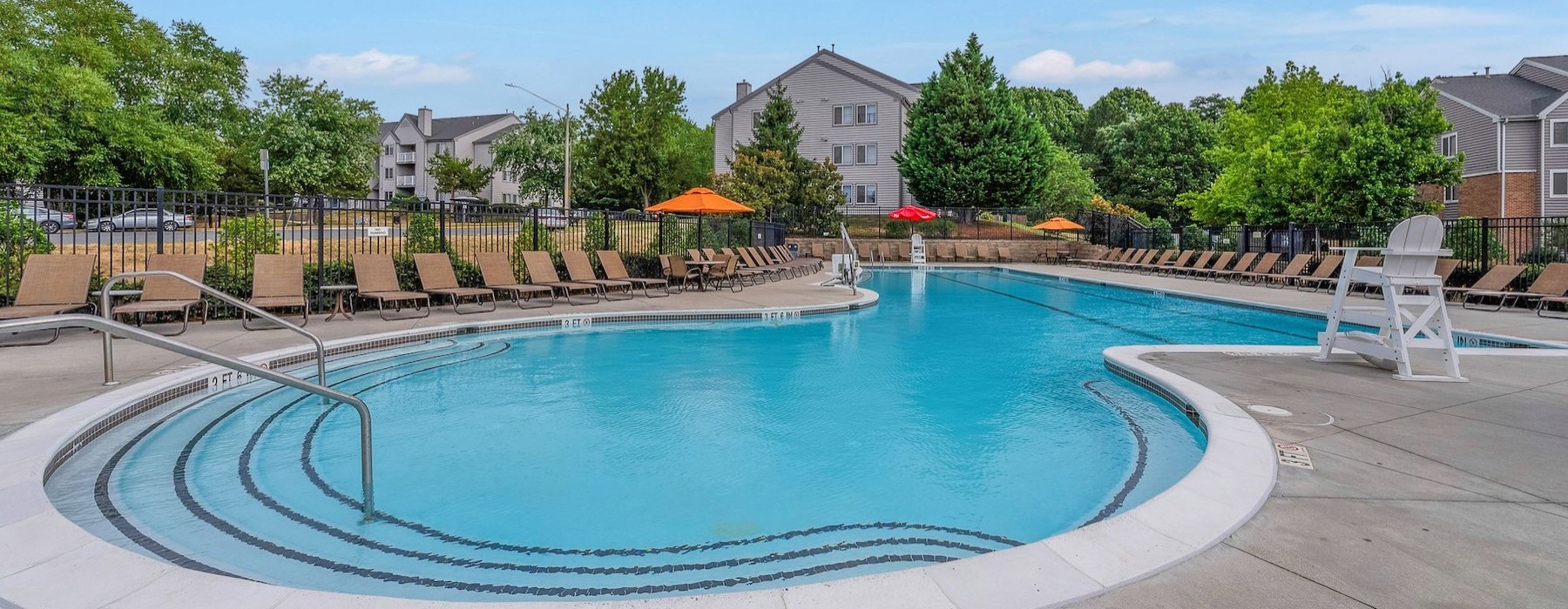 a swimming pool with a fence around it